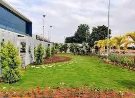 Commercial & Contract Gardening Services Perth – Well-maintained corporate landscape with lush green lawn, trees, and decorative plants.